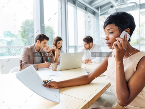 demo-attachment-133-serious-businesswoman-with-documents-talking-on-P9Q6LX6